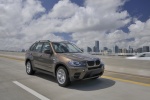 2013 BMW X5 xDrive35i in Sparkling Bronze Metallic - Driving Front Right View
